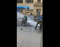 Collab WINY - Men Deflects Water with Slab of Wood from the fire hydrant