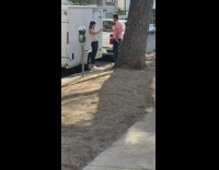 Girl hold drink parking meter white cargo