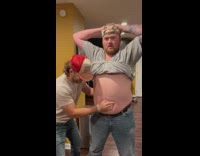 Man sing while belly is used as drum beat