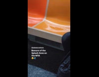 Water puddle on subway train orange seat