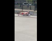 Shirtless guy sunbathes alone next to river 