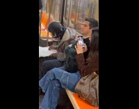 Artist drawing passengers on subway