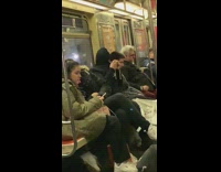 Guy ties up hoodie over face and goes to sleep on subway