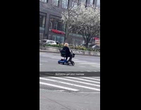 Woman ride mobility scooter on the road