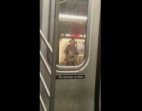 Guy wears Penny Wise costume on subway 