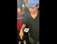 Guy in blue hat makes card spin in air crowd goes crazy 1