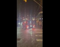 Man drives a Polaris slingshot on the grinch costume 