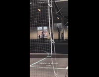 Pennywise the Clown walks through basketball court in Brooklyn Bridge Park