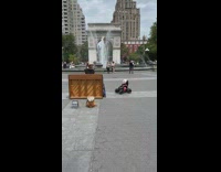 2 dolls on cars listen to pianist 