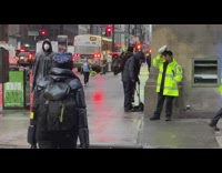 Man sweeps the street with tons of garbage 