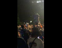 Collab winy - Cyclist with trash can on head surrounded by people