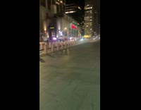 Shirtless guy wearing black shorts jogs outside 