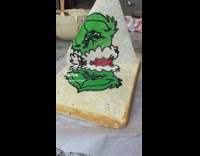 Woman bakes the grinch bread with snow flakes