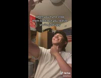 Guy white shirt trying to take selfie 