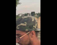 Guy rides bike over dirt ramps 