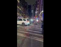 Person dressed as Christmas tree rides bike