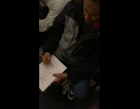 Guy draws sketches cartoon fairy on subway train