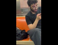 Doll head inside bag of train passenger