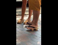 Guy wear japanese wooden sandals on street