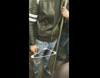 Man has a white clothes hanger hung onto his belt loop on subway train #BluePointWhatTheL