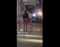Two guys fight over woman at sidewalk 