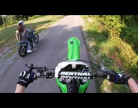 Guy on dirt bike bumps into his friend filming