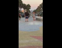 Mother grey dress dance kid watch statue surfboard