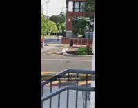 Mother red shirt middle pedestrian baby trolley