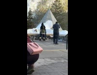 Lady in Blue Face Paint Pose for Picture