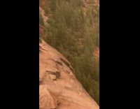 Girls sit rock cliff waterfalls Nevada falls