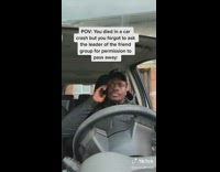 Guy black jacket driving car makes phone call