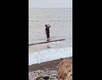 Guy black shirt catch beer shotgun beach