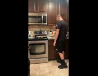 Guy tries to sneak treat for his black dog 