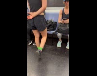 Woman using resistance bands on train