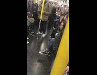 Girl brushes teeth crowded subway green toothbrush 