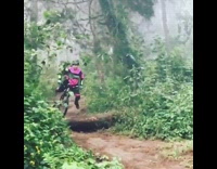 Kid riding bike in the forest, hits brakes and flies off his bike