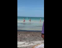 Woman bikini hold Canada flag beach vendor