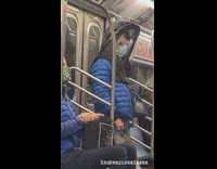 Guy wears face mask under black hood 