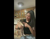 Puppy Bite Ladys Hand as she Plays with it