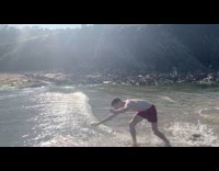 Guy does acrobatic tricks in the water