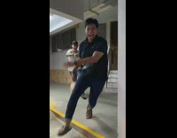 Guy white shirt runs at crowd of friends with cockroach 