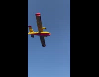 Airplane glides on the ocean and gets water