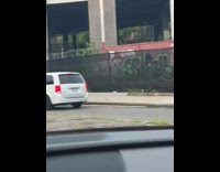 Man chair on head boxing gloves street