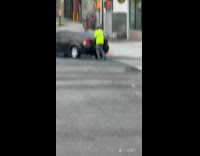 DSNY workers helping and pushing broken down car 