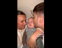 Baby cries from loud kisses of parents
