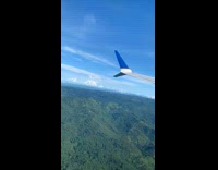 Airplane takes off runway to Caribbean sea