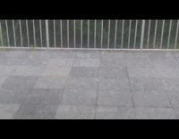 Hail storm causes street to flood balcony 