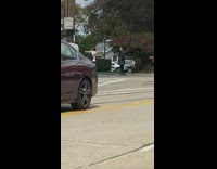 Guy black suit hands on pocket street