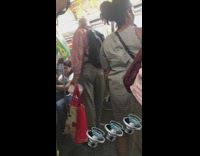 old man red shirt signing busy train