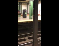 Couple drags and pushes UHD Tv box through subway station